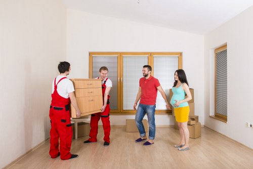 Removal team loading furniture efficiently for a Brentpark apartment relocation