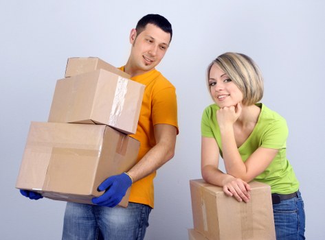 Packed boxes and furniture prepared for small removals in Brentpark