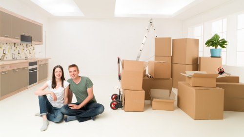 Professional movers handling furniture during a Brentpark relocation