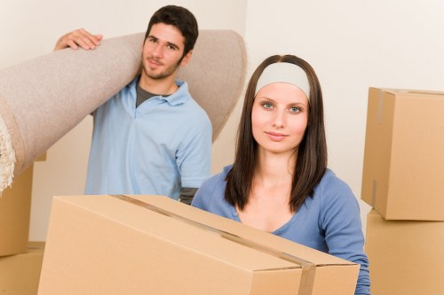 Packing boxes and preparing belongings for a Brentpark flat move