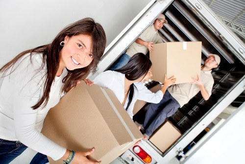Local removals team loading household items in Brentpark