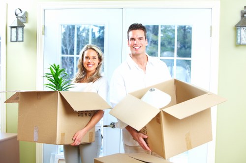 Professional movers loading furniture for a Brentpark home move